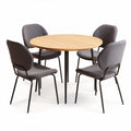 Round dining table with four upholstered chairs in gray fabric and wooden top